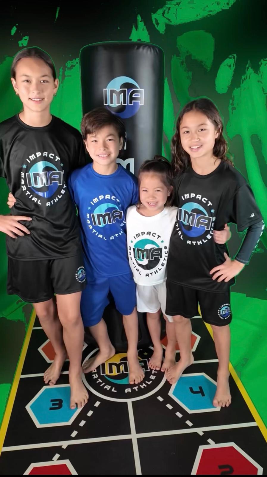 Group of girls at IMA Summer Camp showing their boxing skills