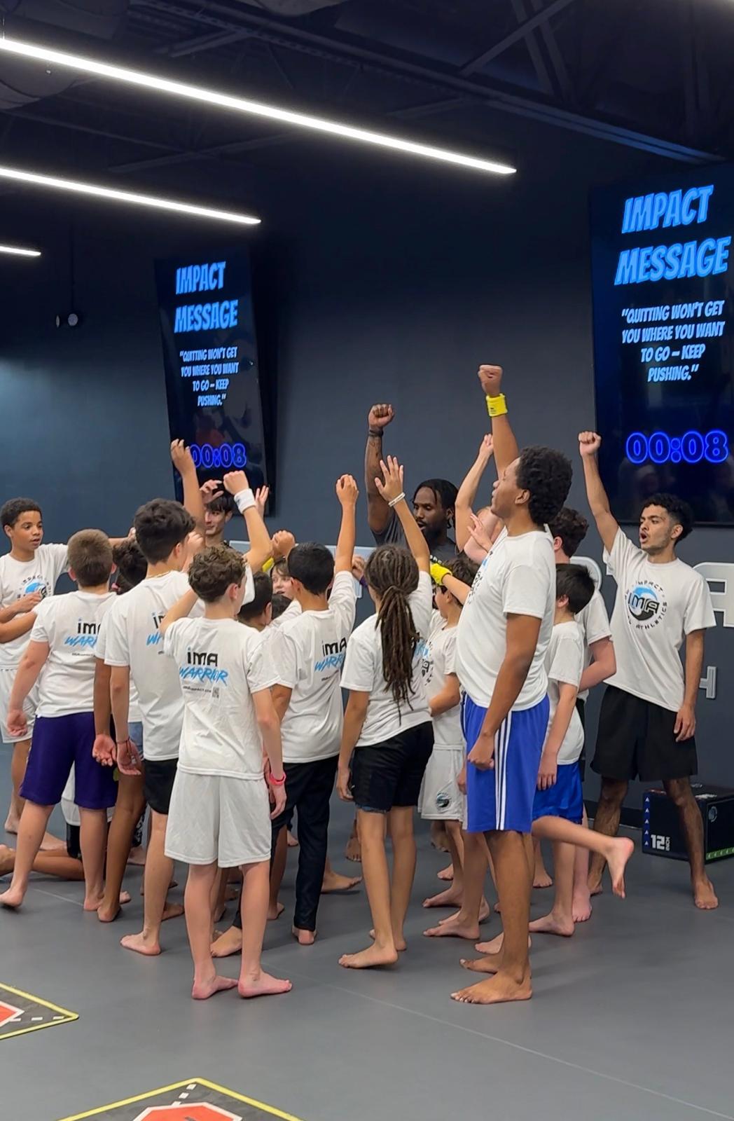 Instructor teaching mindset and leadership Impact Message to kids at IMA camp