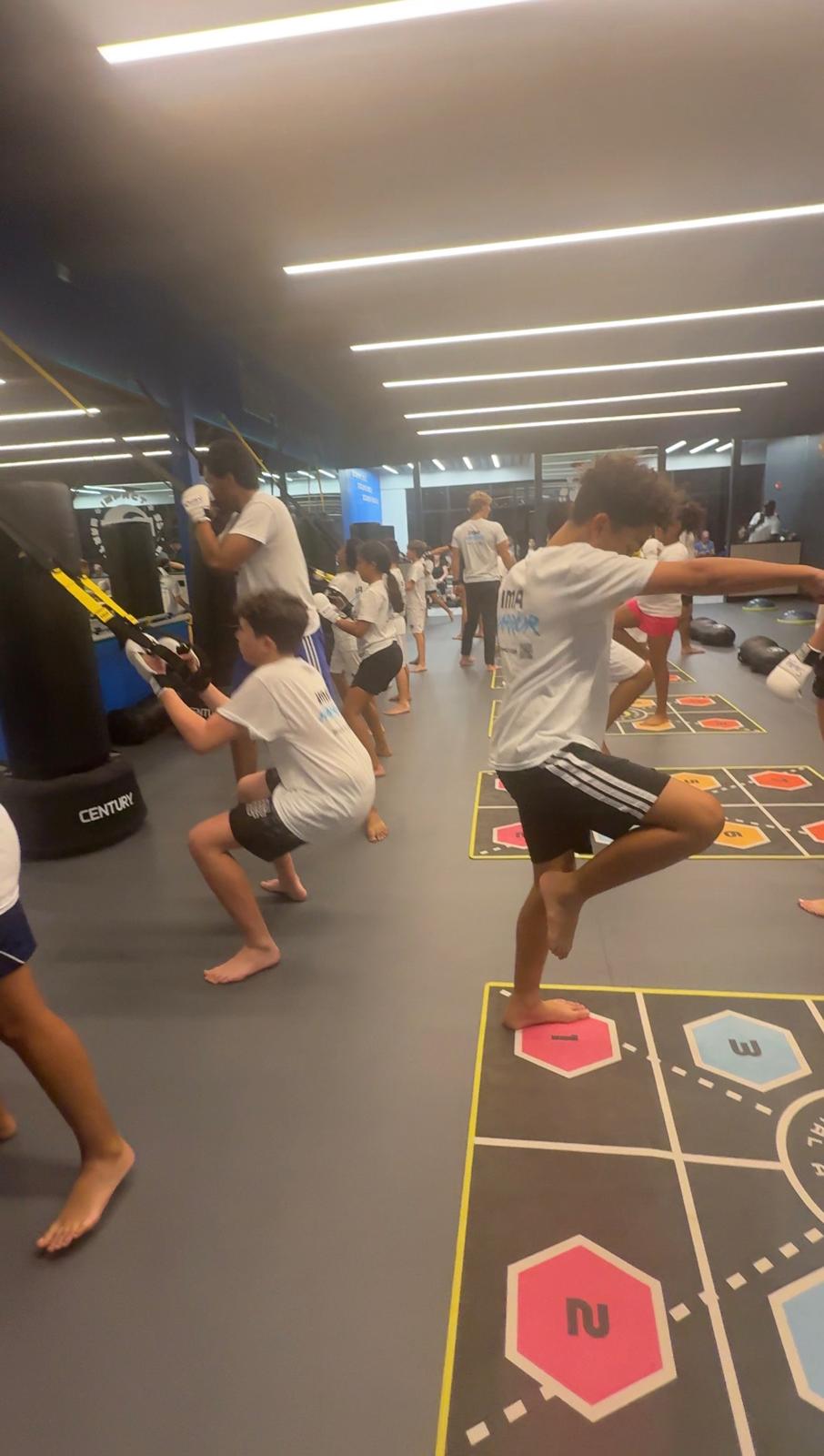 Kids doing agility training at IMA Summer Camp
